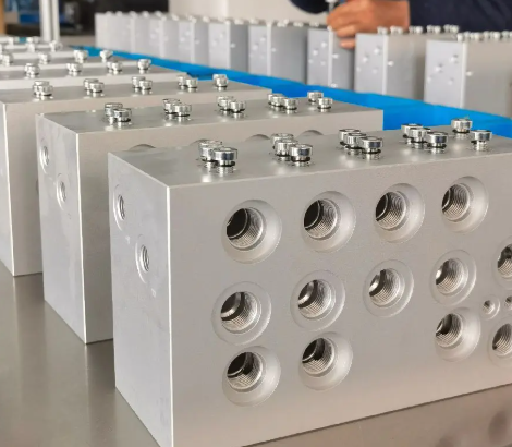 Surface finishing examples on machined manifold block parts