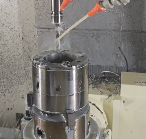 CNC milling machine cutting a titanium alloy component
