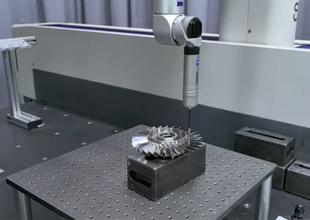 CNC machined titanium part showing tight dimensional tolerances with CMM inspection