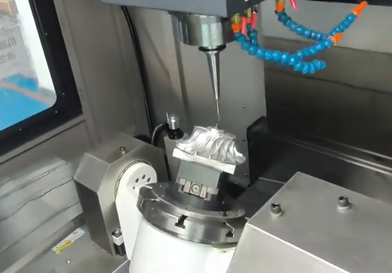 5-axis CNC milling machine producing complex geometric components