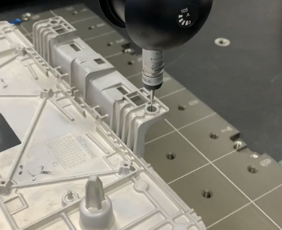 Engineer inspecting a rapid prototype part