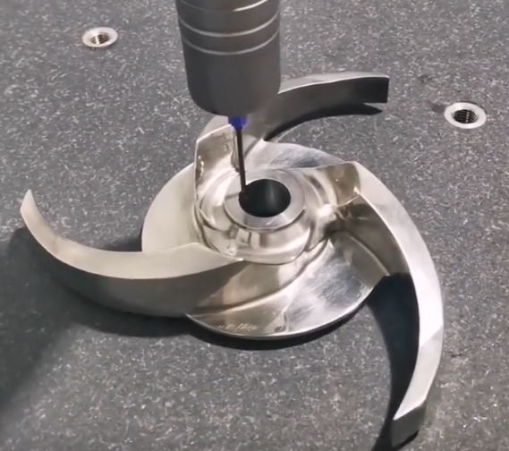 Engineer quality control inspecting a precision machined part