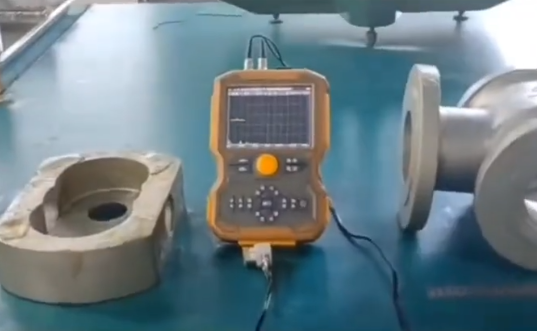 Engineer inspecting CNC machined parts in oil and gas factory