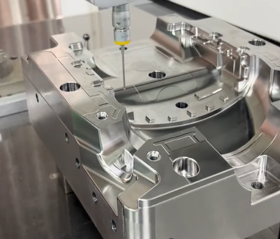 Engineer inspecting CNC machined automotive components