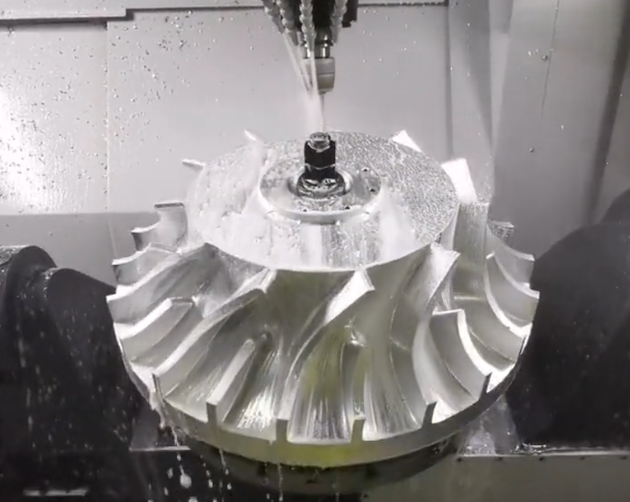 Industrial CNC machining center producing large aluminum impeller parts